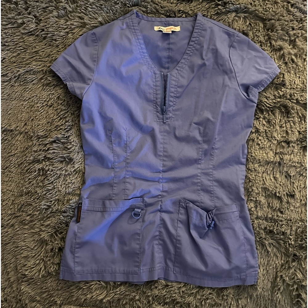 Koi top. Color ceil blue. Size XS.
